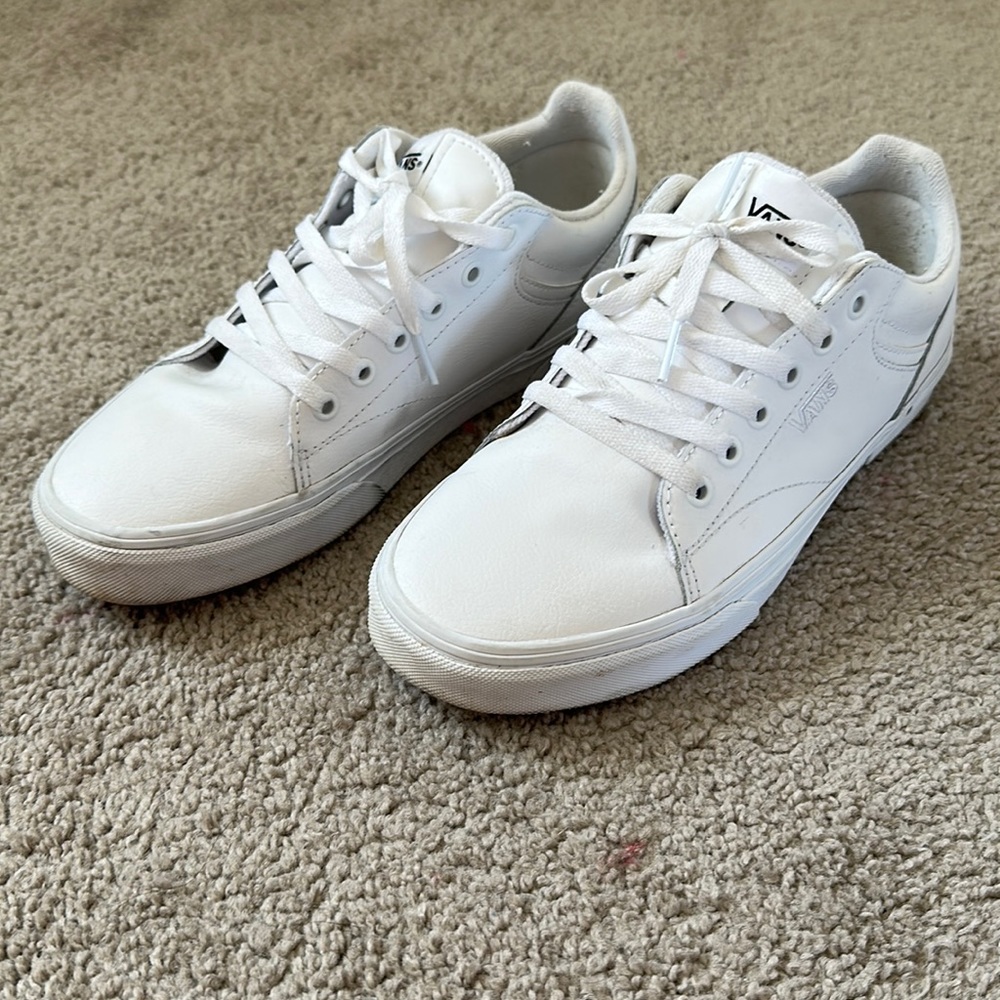 Women’s white leather Vans sneakers